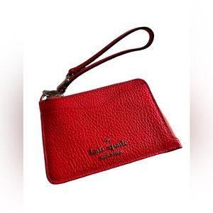 Super cute small Kate Spade bright red wallet. Hang off your wrist or belt!